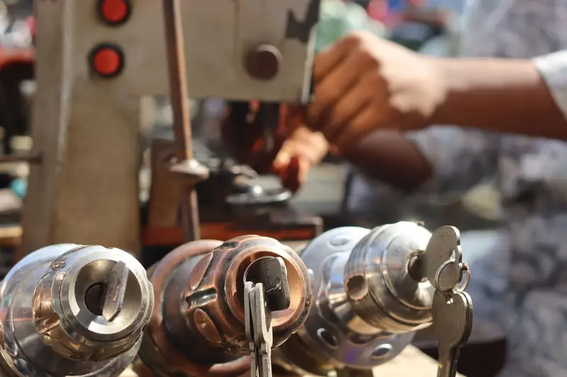 Close-up of a locksmith cutting keys on a machine