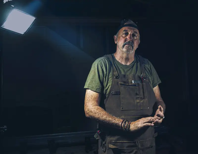 A tradesman in a work apron
